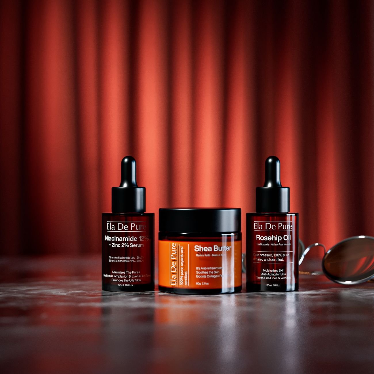 Sophisticated skincare product setup featuring niacinamide serum, shea butter, and rosehip oil with rich dramatic lighting.